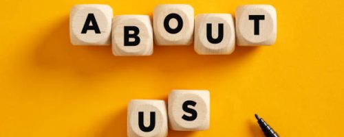 The word about us on wooden cubes. Business communication and information concept.